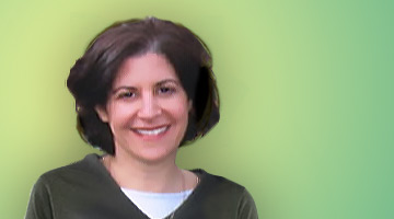 Headshot of Nancy on green background